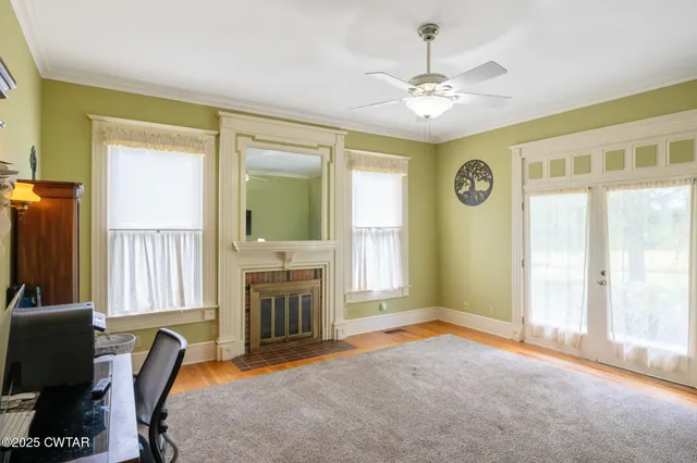 a view of a livingroom with furniture and a window