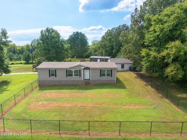 a view of kitchen with stove and cabinets