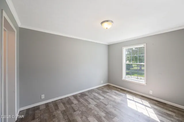 a bathroom with a granite countertop sink mirror and bathtub