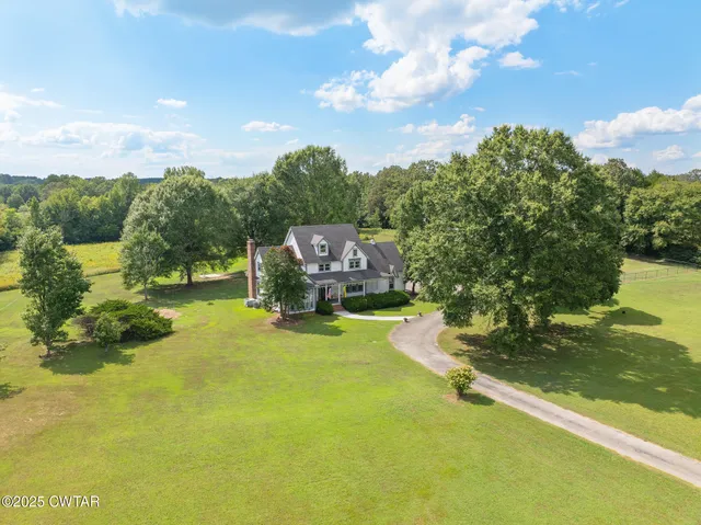 a swimming pool with trees in the background