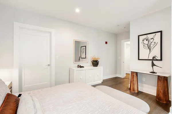 a bedroom with a bed and a desk
