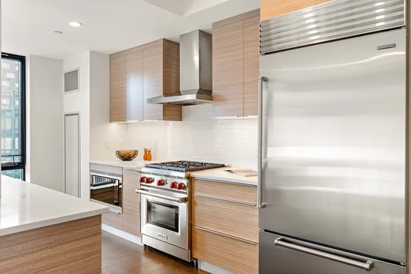 a kitchen with a stove and a refrigerator