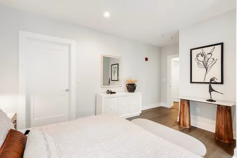 a bedroom with a bed and a desk