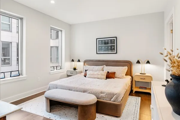 a bedroom with furniture and a window