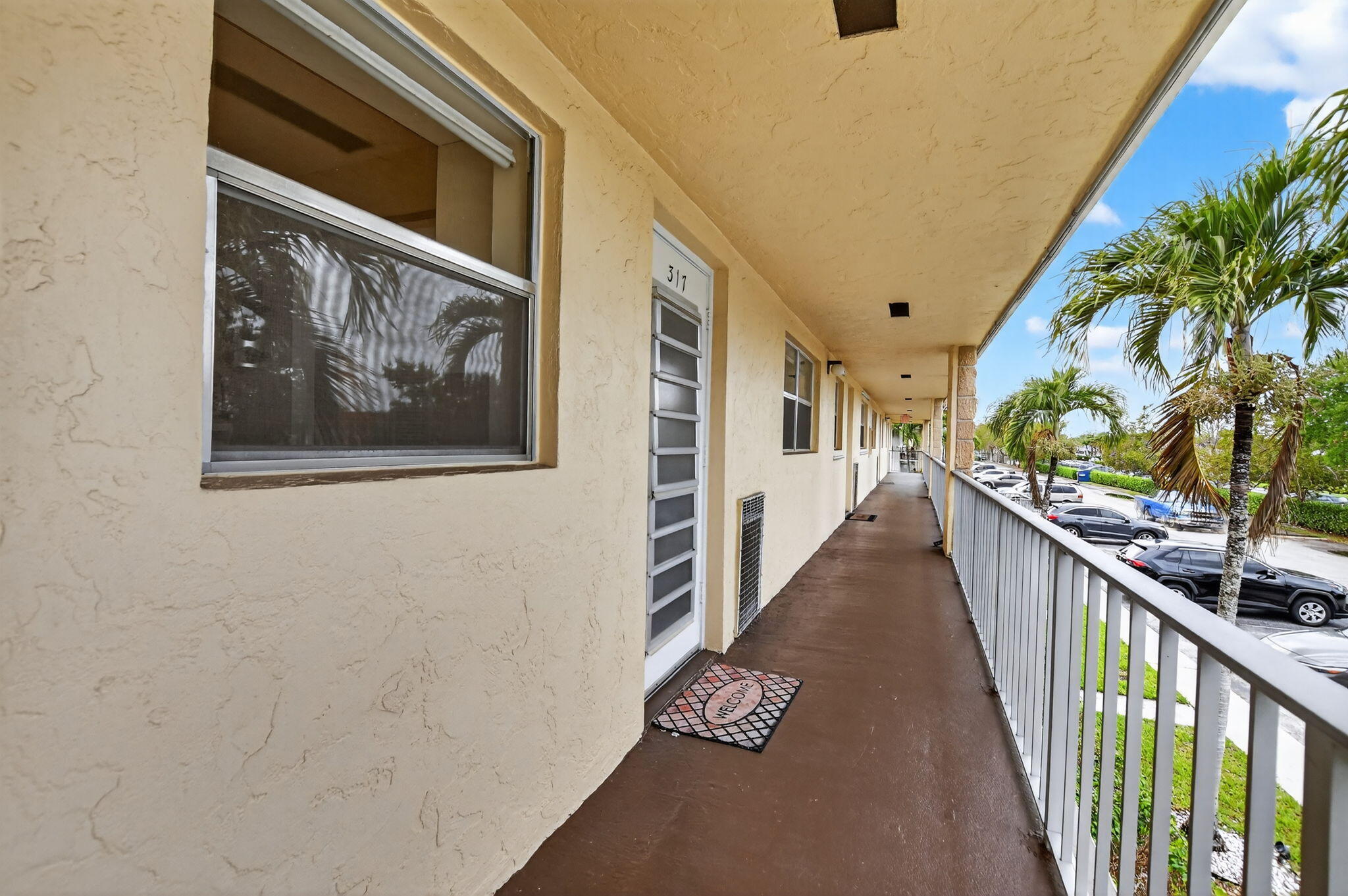 9855 Sandalfoot Boulevard, Unit 317 Boca Raton, FL 33428 - Photo 3 of 29 3-web-or-mls-DSC_4684