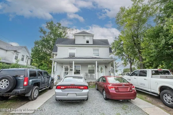 a car parked in front of a house