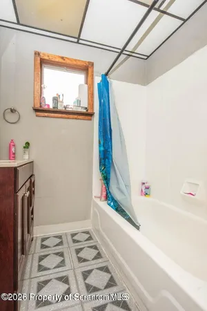 a bathroom with a sink a bath tub and a shower