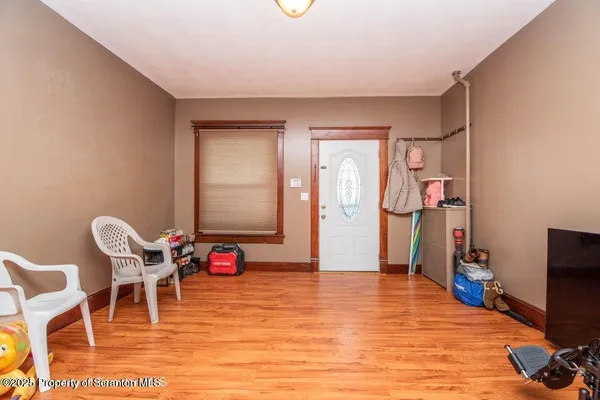 a room with furniture and wooden floor