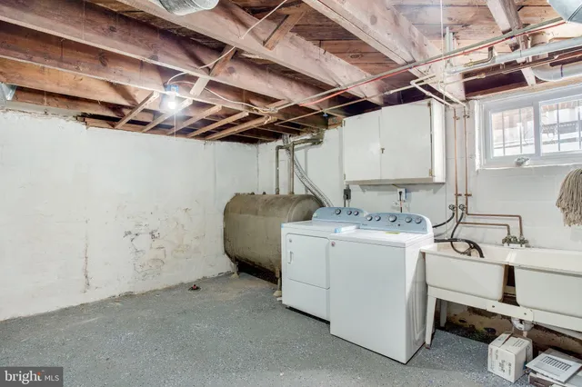 a utility room with dryer and washer