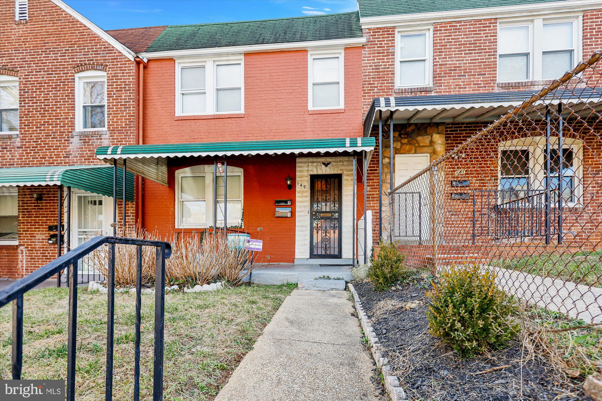 149 Denison Street, Unit 2 Baltimore, MD 21229 - Photo 2 of 24 a front view of a house with garden