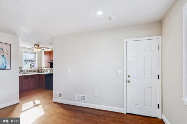a view of workspace with wooden floor and cabinet