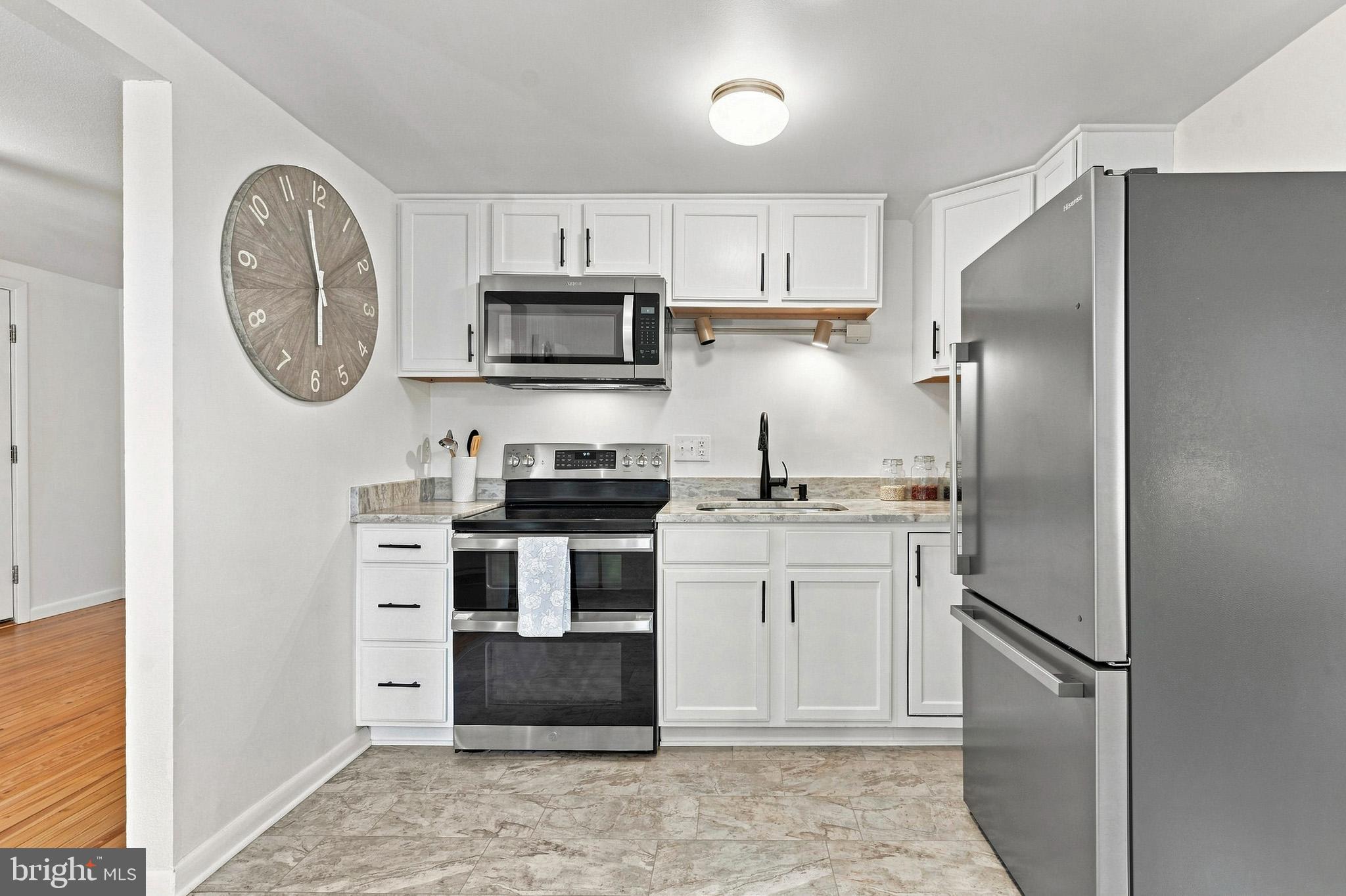 11407 Rawhide Road Lusby, MD 20657 - Photo 18 of 64 Clean white cabinets with lots of storage.