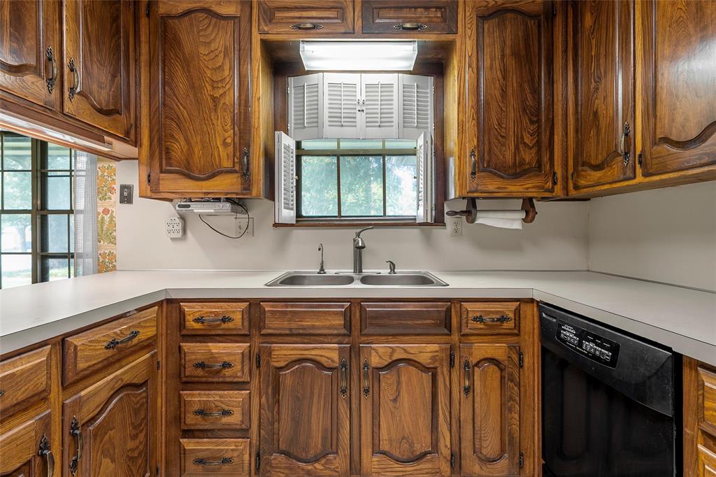 219 Opal Street Hewitt, TX 76643 - Photo 11 of 28 a kitchen with stainless steel appliances granite countertop a sink and a cabinets