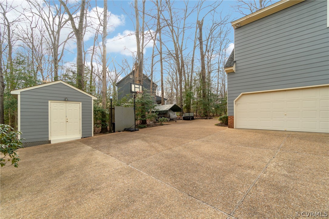 14621 Benefice Ridge Chesterfield, VA 23838 - Photo 11 of 49 a view of a house with a yard and garage
