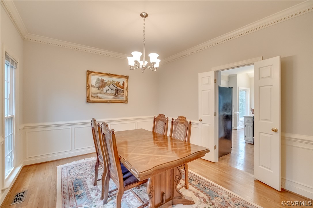 14621 Benefice Ridge Chesterfield, VA 23838 - Photo 19 of 49 a view of a dining room with furniture and wooden floor