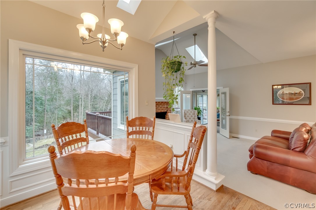 14621 Benefice Ridge Chesterfield, VA 23838 - Photo 25 of 49 a dining room with furniture a large window and a chandelier