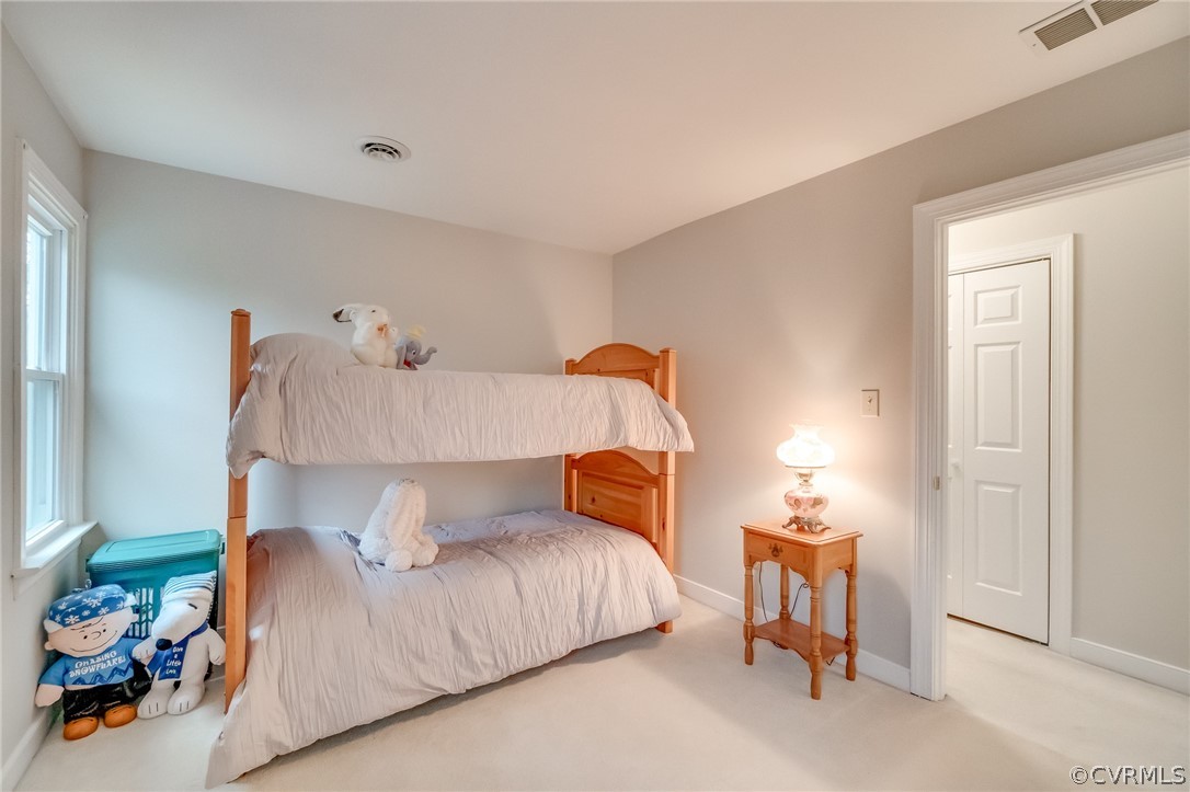 14621 Benefice Ridge Chesterfield, VA 23838 - Photo 37 of 49 a bedroom with a bed and a lamp