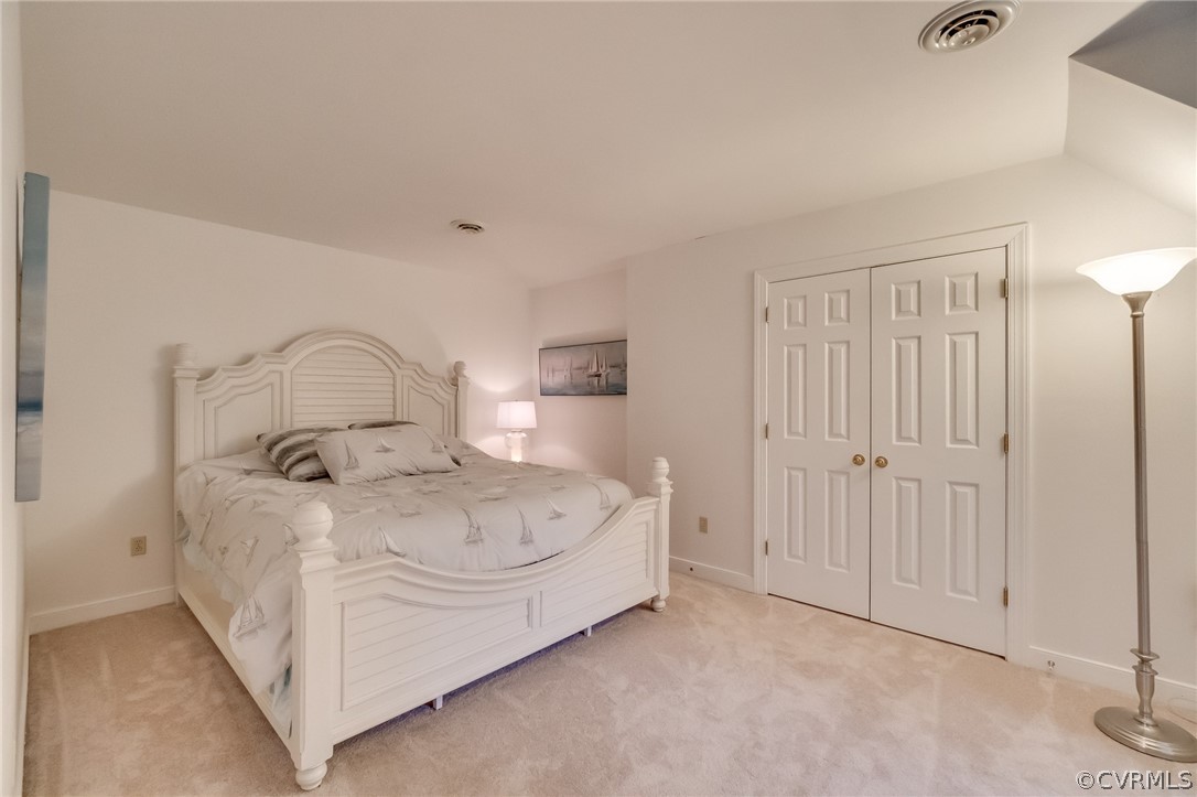 14621 Benefice Ridge Chesterfield, VA 23838 - Photo 38 of 49 a bedroom with a bed and a cabinet