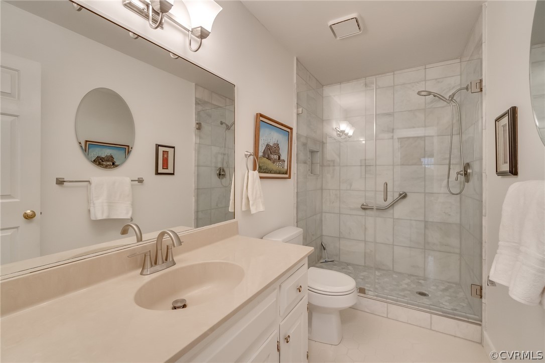 14621 Benefice Ridge Chesterfield, VA 23838 - Photo 43 of 49 a bathroom with a sink toilet a mirror and shower