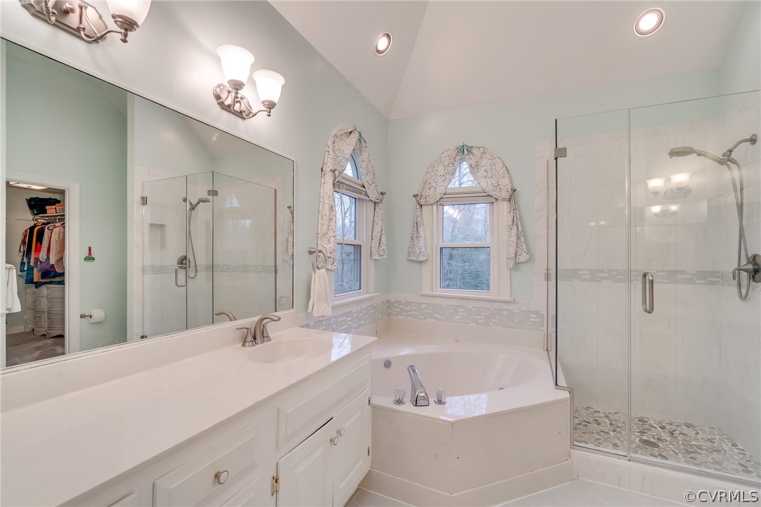 14621 Benefice Ridge Chesterfield, VA 23838 - Photo 46 of 49 a spacious bathroom with a sink a mirror a bathtub and shower