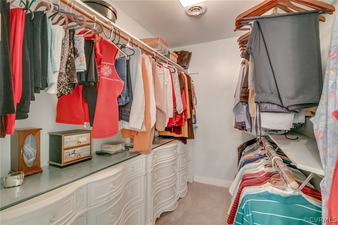 14621 Benefice Ridge Chesterfield, VA 23838 - Photo 48 of 49 a view of walk in closet with clothes and shoes