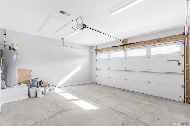 a spacious bathroom with a granite countertop sink mirror and toilet