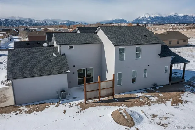 a view of a house with a snow on the road