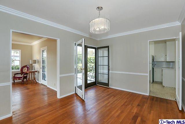 538 Alhambra Road San Gabriel, CA 91775 - Photo 2 of 6 an empty room with wooden floor and mirror