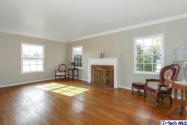 538 Alhambra Road San Gabriel, CA 91775 - Photo 3 of 6 a view of a livingroom with furniture a fireplace and wooden floor