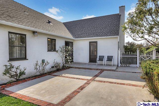 538 Alhambra Road San Gabriel, CA 91775 - Photo 5 of 6 a house with potted plants in front of it