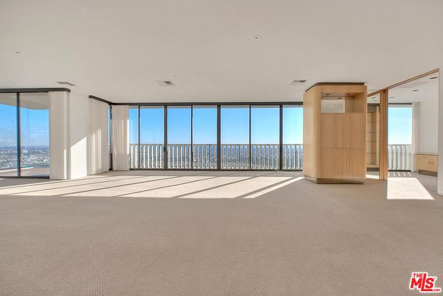 a view of a chairs and tables in the patio