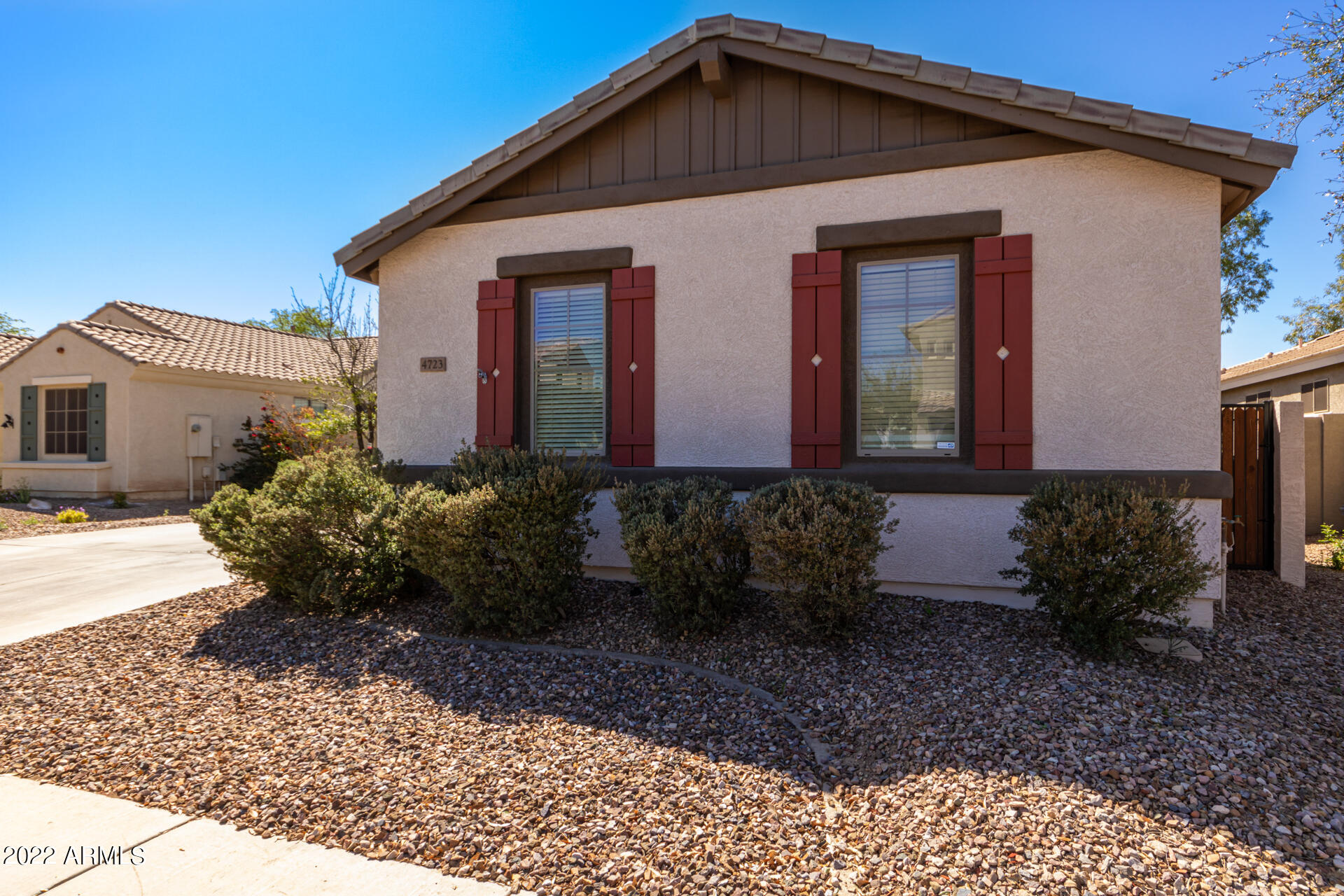 4723 East Timberline Road Gilbert, AZ 85297 - Photo 4 of 30 a front view of a house with garden