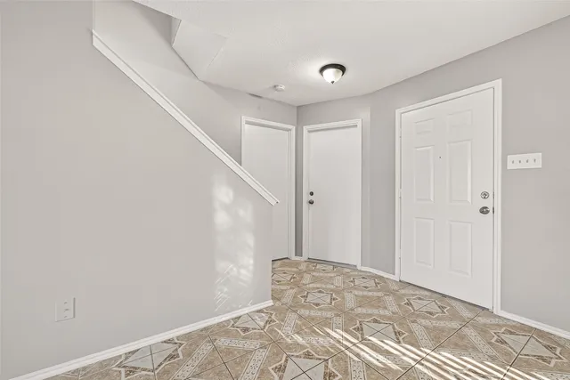 a view of a big room with wooden floor and closet