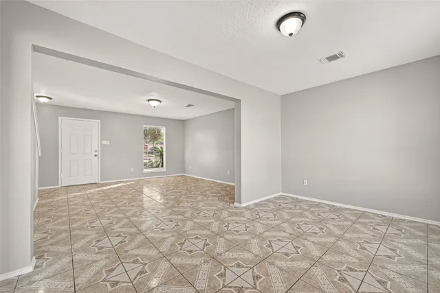 a view of an empty room and window