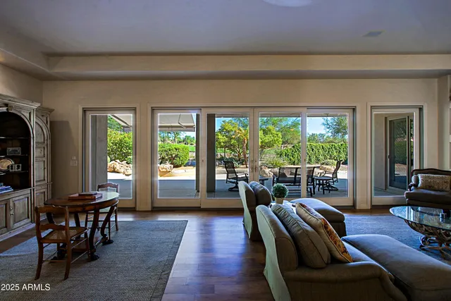 a kitchen with granite countertop a refrigerator and a stove top oven