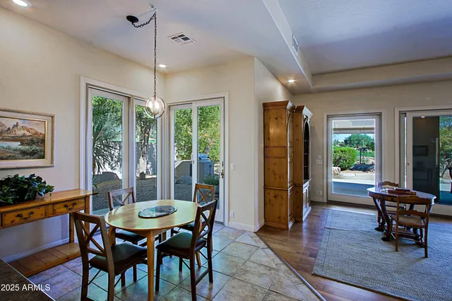 a bathroom with a shower a toilet and a window