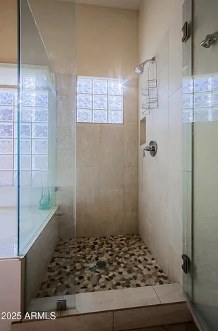 an aerial view of a house with a yard and furniture