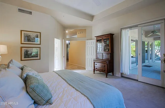 a living room with furniture a rug and a chandelier