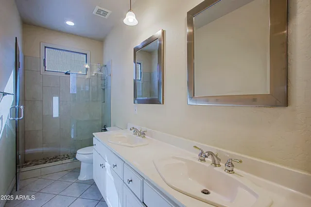 a room with furniture a large window and a sink