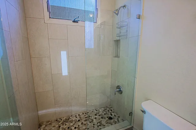 an aerial view of residential building and parking space