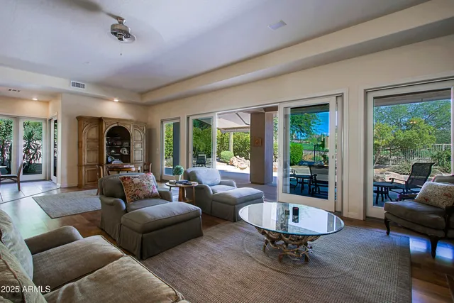 a view of a livingroom with furniture and a flat screen tv