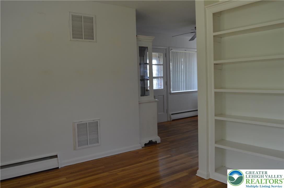 1819 Blue Barn Road Orefield, PA 18069 - Photo 8 of 21 Hardwood floors and built-in shelving define this versatile living space, ready for your personal touch.