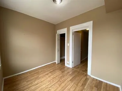 a view of a livingroom with wooden floor and closet