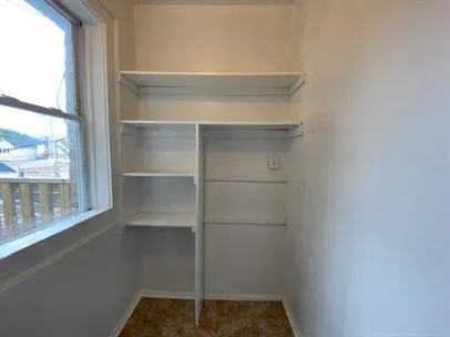 a empty closet with a window