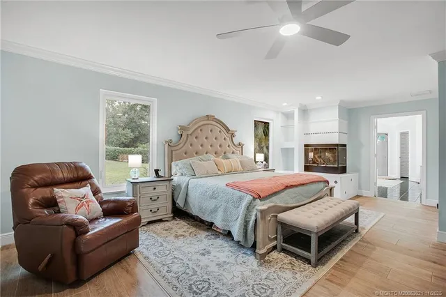 a bedroom with a bed couch and window