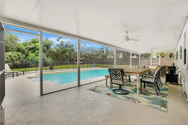 a view of a patio with a table and chairs