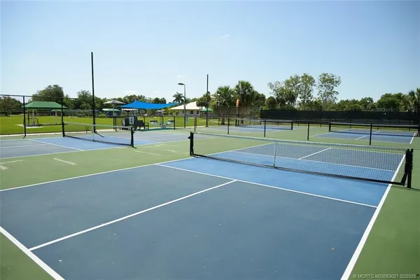 a tennis court that has tennis net