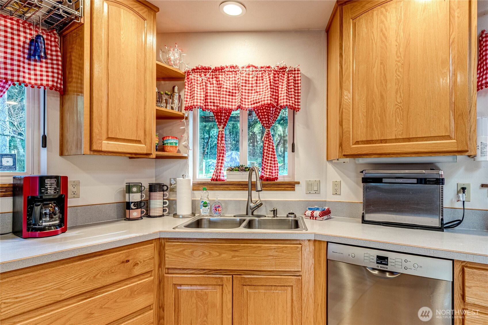 73 Ross Lane Port Angeles, WA 98363 - Photo 11 of 40 a kitchen with stainless steel appliances granite countertop a sink and a cabinets