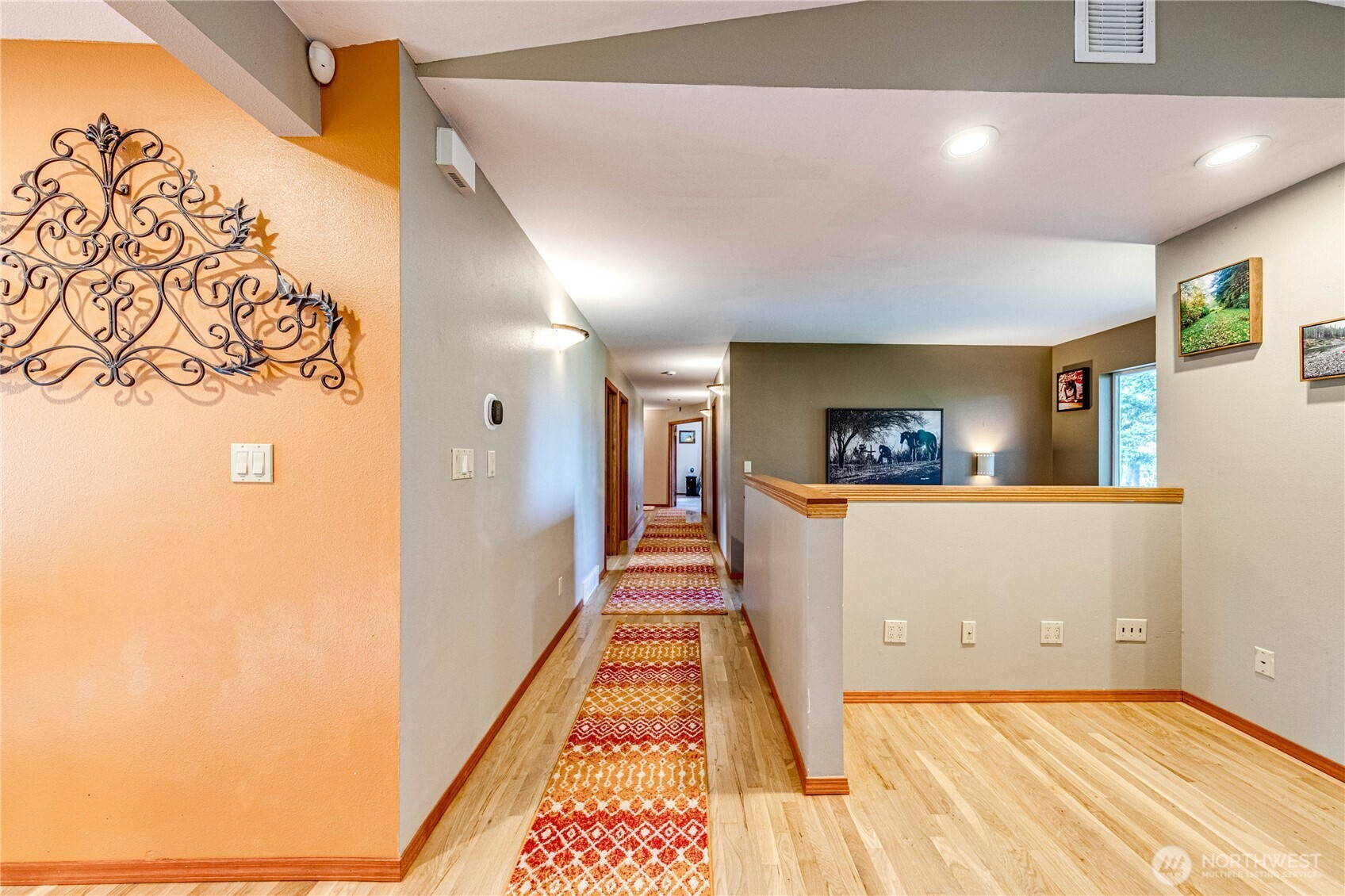 73 Ross Lane Port Angeles, WA 98363 - Photo 15 of 40 a view of a hallway to a room with wooden floor and furniture