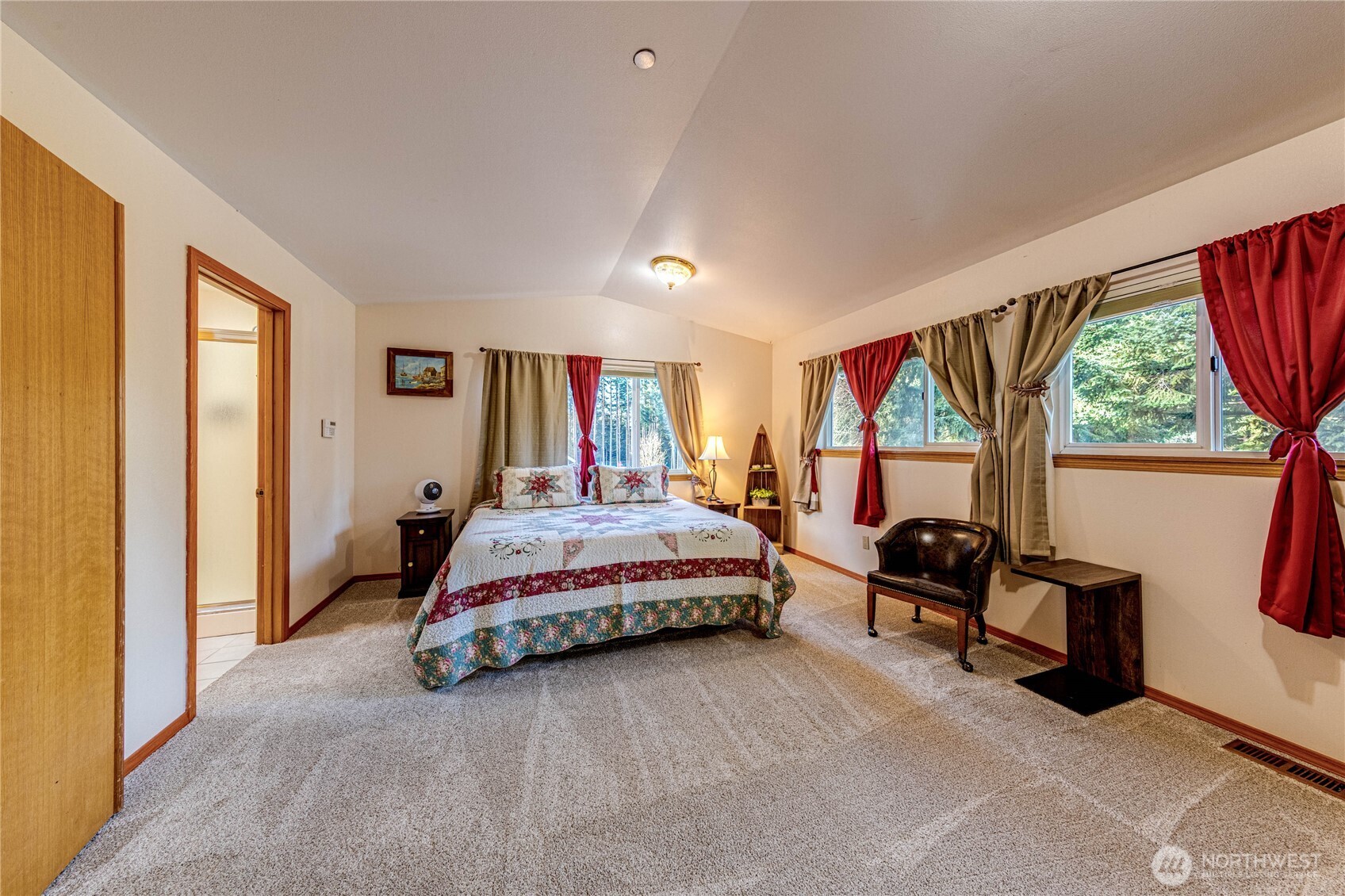 73 Ross Lane Port Angeles, WA 98363 - Photo 22 of 40 a spacious bedroom with a bed and a large window